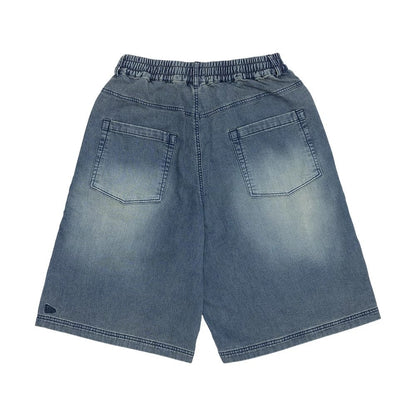 The model is wearing this New Era Washed Bermuda Shorts in blue. 6