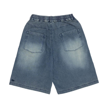 The model is wearing this New Era Washed Bermuda Shorts in blue. 2