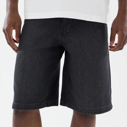 The model is wearing this New Era Washed Bermuda Shorts in black. 3