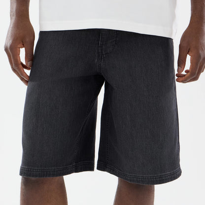 The model is wearing this New Era Washed Bermuda Shorts in black. 3
