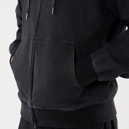 The model is wearing this New Era Washed Full Zip Hoodie in black. 5