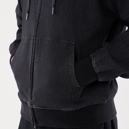 The model is wearing this New Era Washed Full Zip Hoodie in black. 5