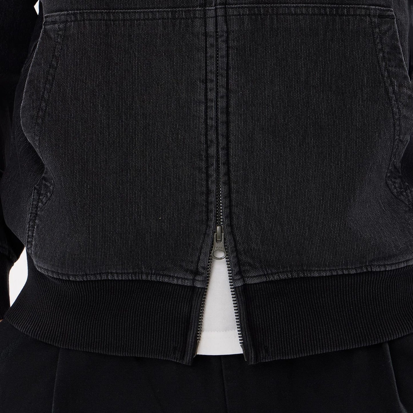 The model is wearing this New Era Washed Full Zip Hoodie in black. 6