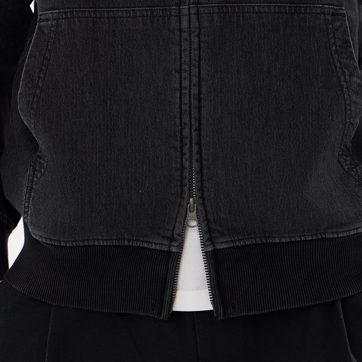 The model is wearing this New Era Washed Full Zip Hoodie in black. 6