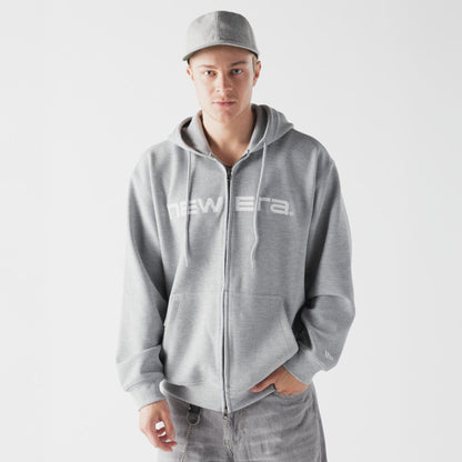 The model is wearing this New Era Waffle Full Zip Hoodie in grey. 1