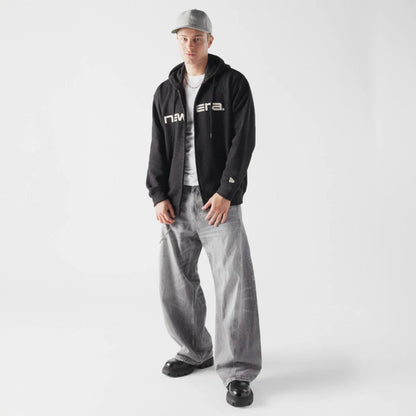 The model is wearing this New Era Waffle Full Zip Hoodie in black. 6