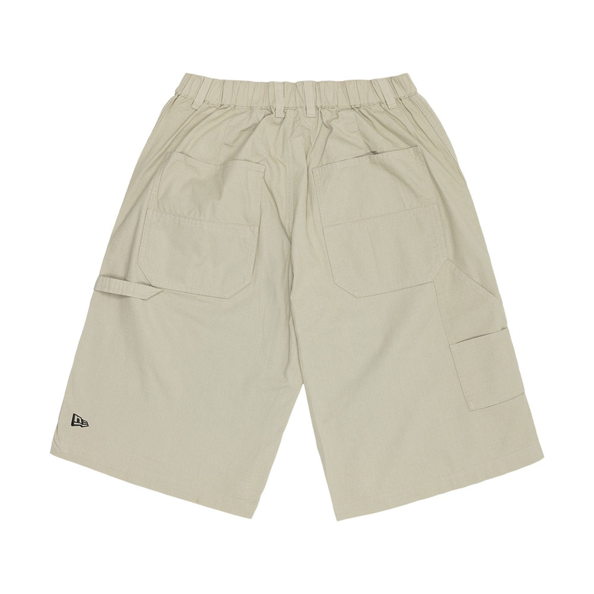 The model is wearing this New Era Canvas Bermuda Shorts in grey. 2