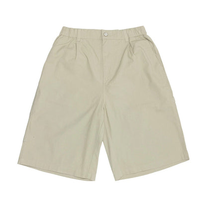 The model is wearing this New Era Canvas Bermuda Shorts in beige. 7