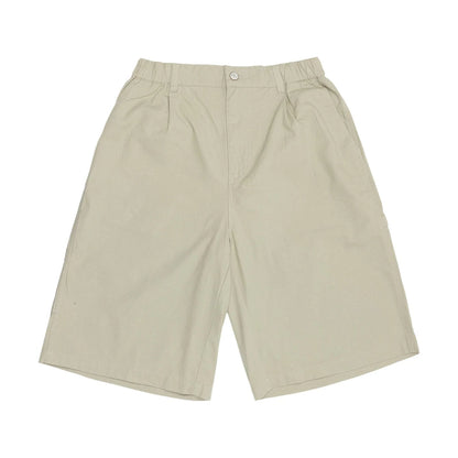 The model is wearing this New Era Canvas Bermuda Shorts in grey. 1