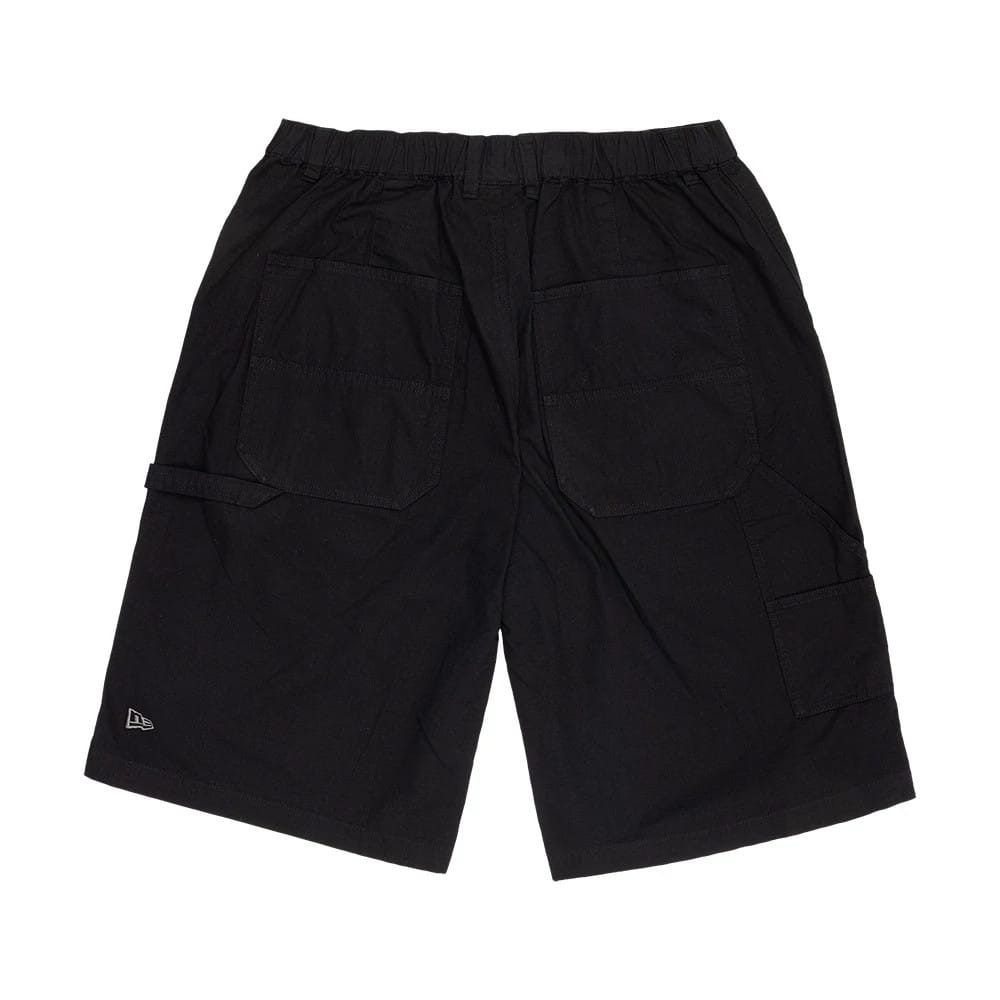 The model is wearing this New Era Canvas Bermuda Shorts in black. 6