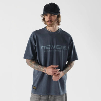 The model is wearing this New Era Originators T-Shirt in navy. 1