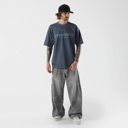The model is wearing this New Era Originators T-Shirt in navy. 5