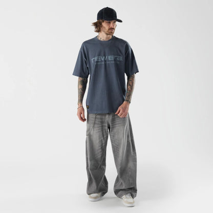 The model is wearing this New Era Originators T-Shirt in navy. 5