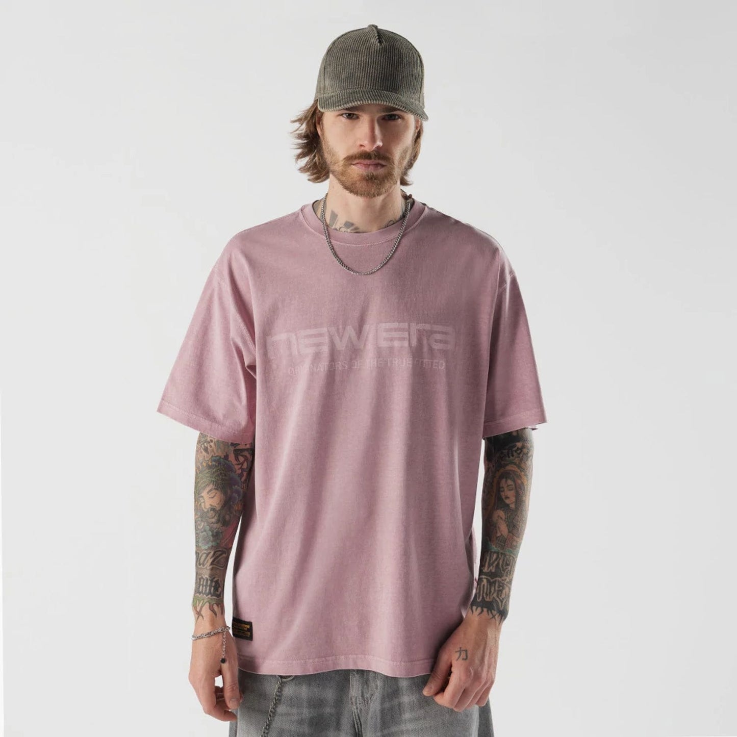The model is wearing this New Era Originators T-Shirt in pink. 1
