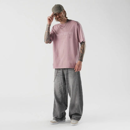 The model is wearing this New Era Originators T-Shirt in pink. 5