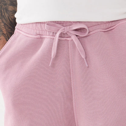 The model is wearing this New Era Originators Oversized Shorts in pink. 5