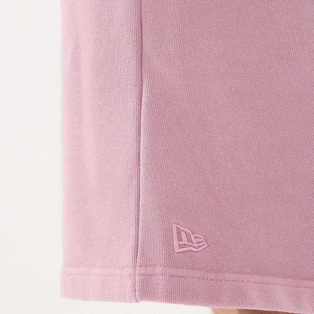 The model is wearing this New Era Originators Oversized Shorts in pink. 6