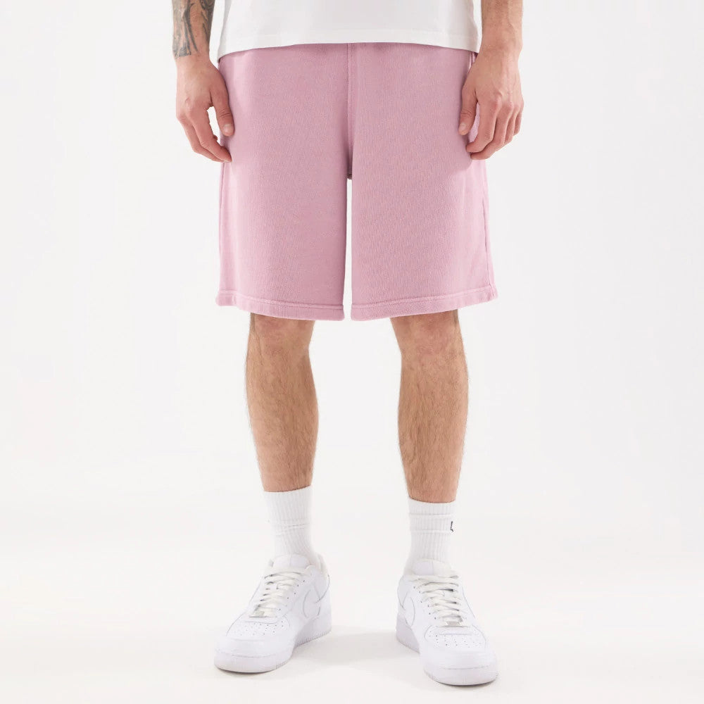 The model is wearing this New Era Originators Oversized Shorts in pink. 1