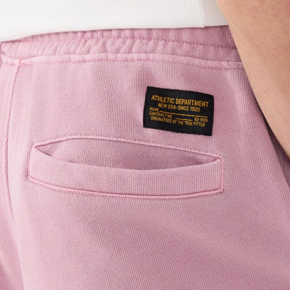 The model is wearing this New Era Originators Oversized Shorts in pink. 4