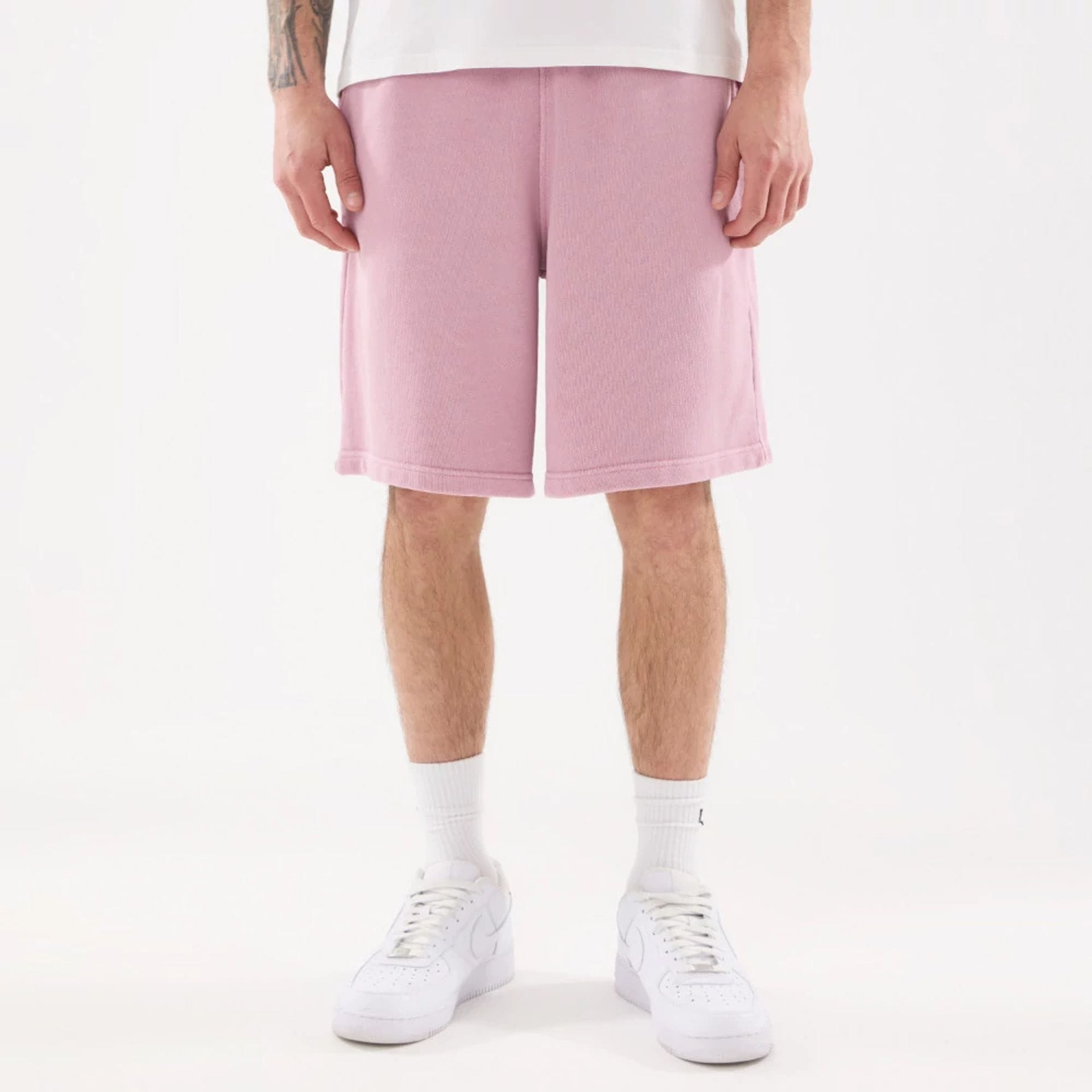 The model is wearing this New Era Originators Oversized Shorts in pink. 7