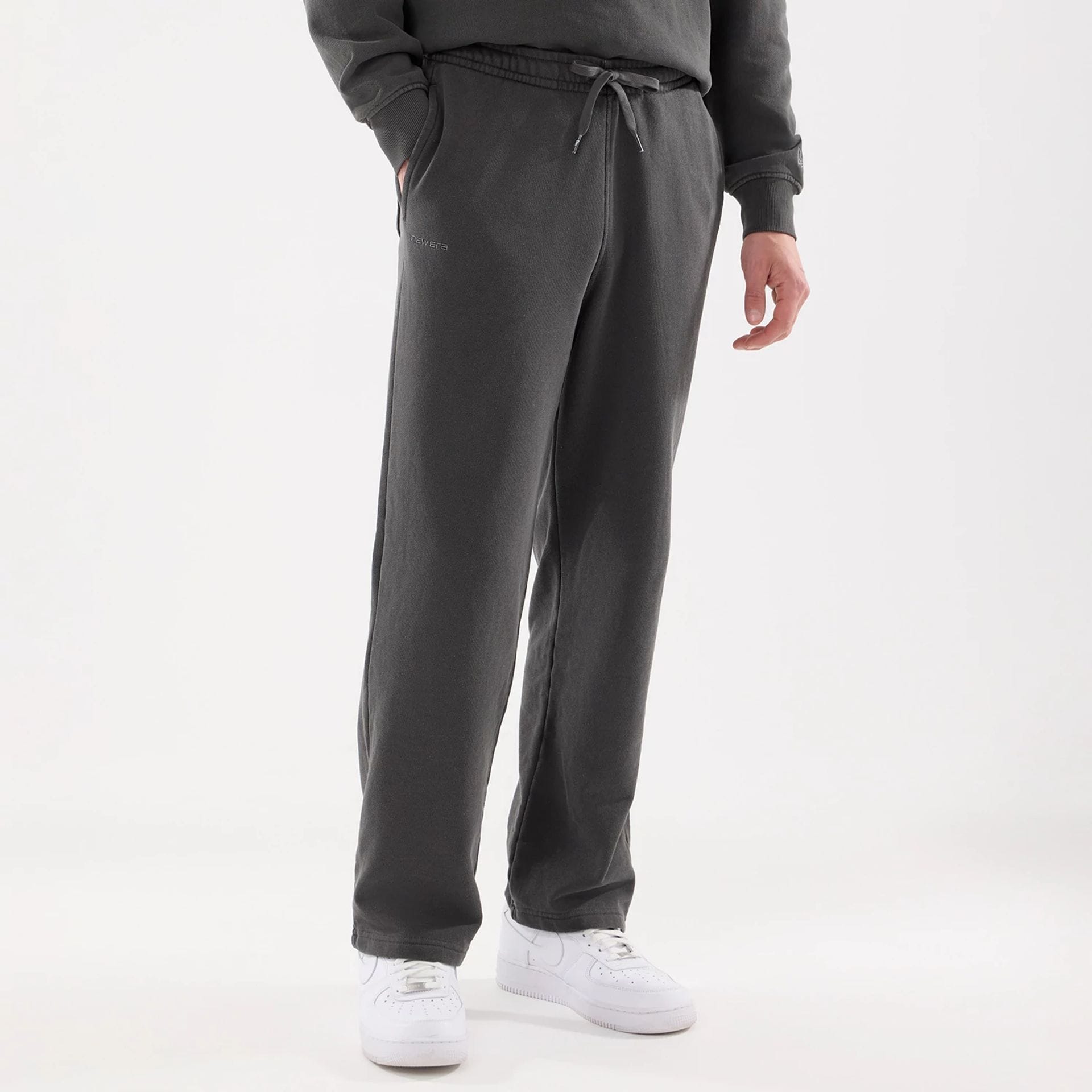 The model is wearing this New Era Originators Straight Leg Joggers in black. 7