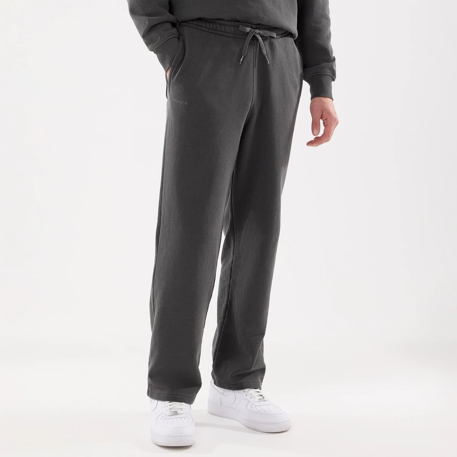 The model is wearing this New Era Originators Straight Leg Joggers in black. 7