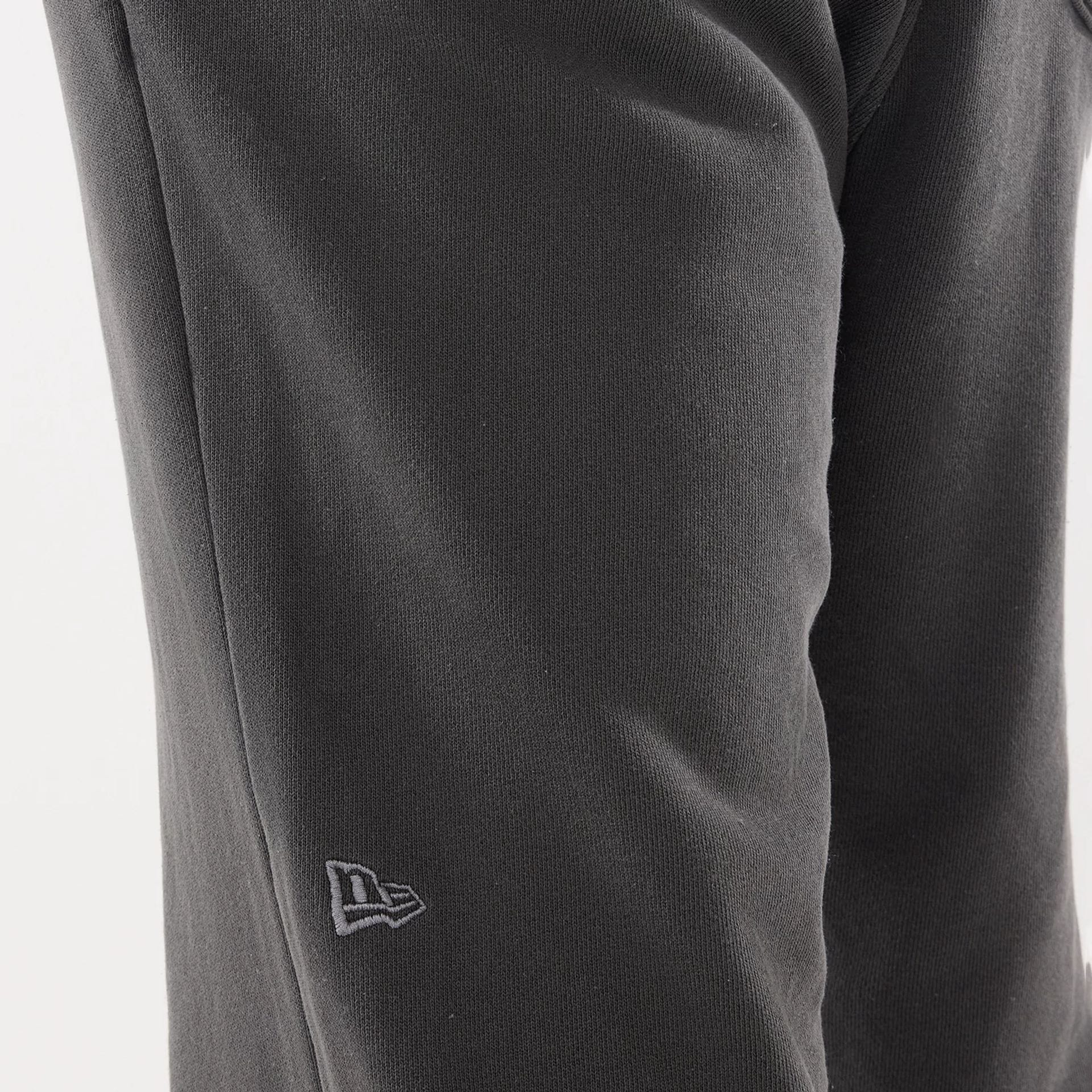 The model is wearing this New Era Originators Straight Leg Joggers in black. 4