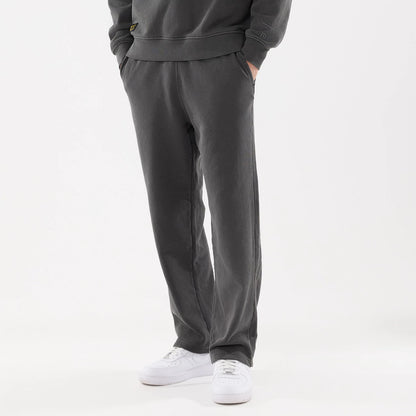 The model is wearing this New Era Originators Straight Leg Joggers in black. 1