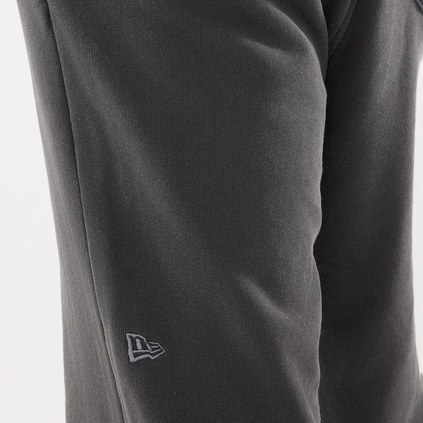 The model is wearing this New Era Originators Straight Leg Joggers in black. 4