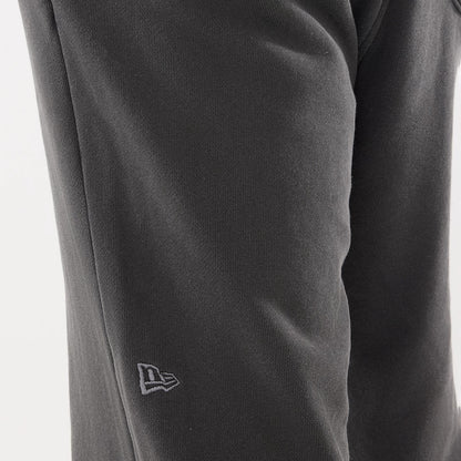 The model is wearing this New Era Originators Straight Leg Joggers in black. 4