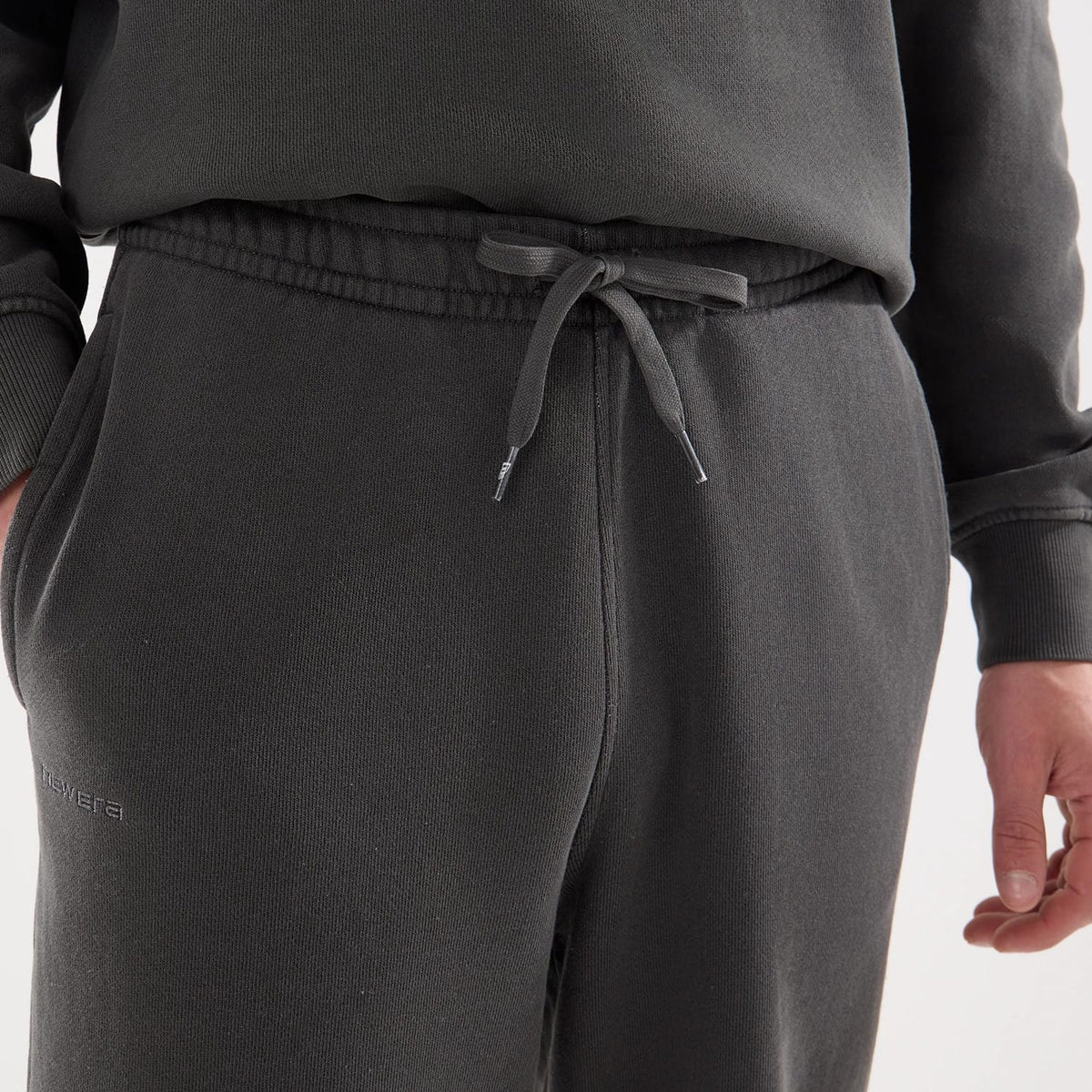 The model is wearing this New Era Originators Straight Leg Joggers in black. 5