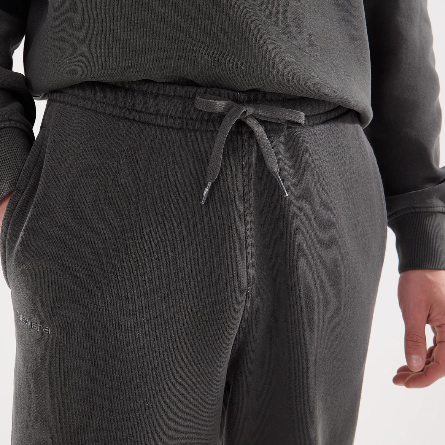 The model is wearing this New Era Originators Straight Leg Joggers in black. 5