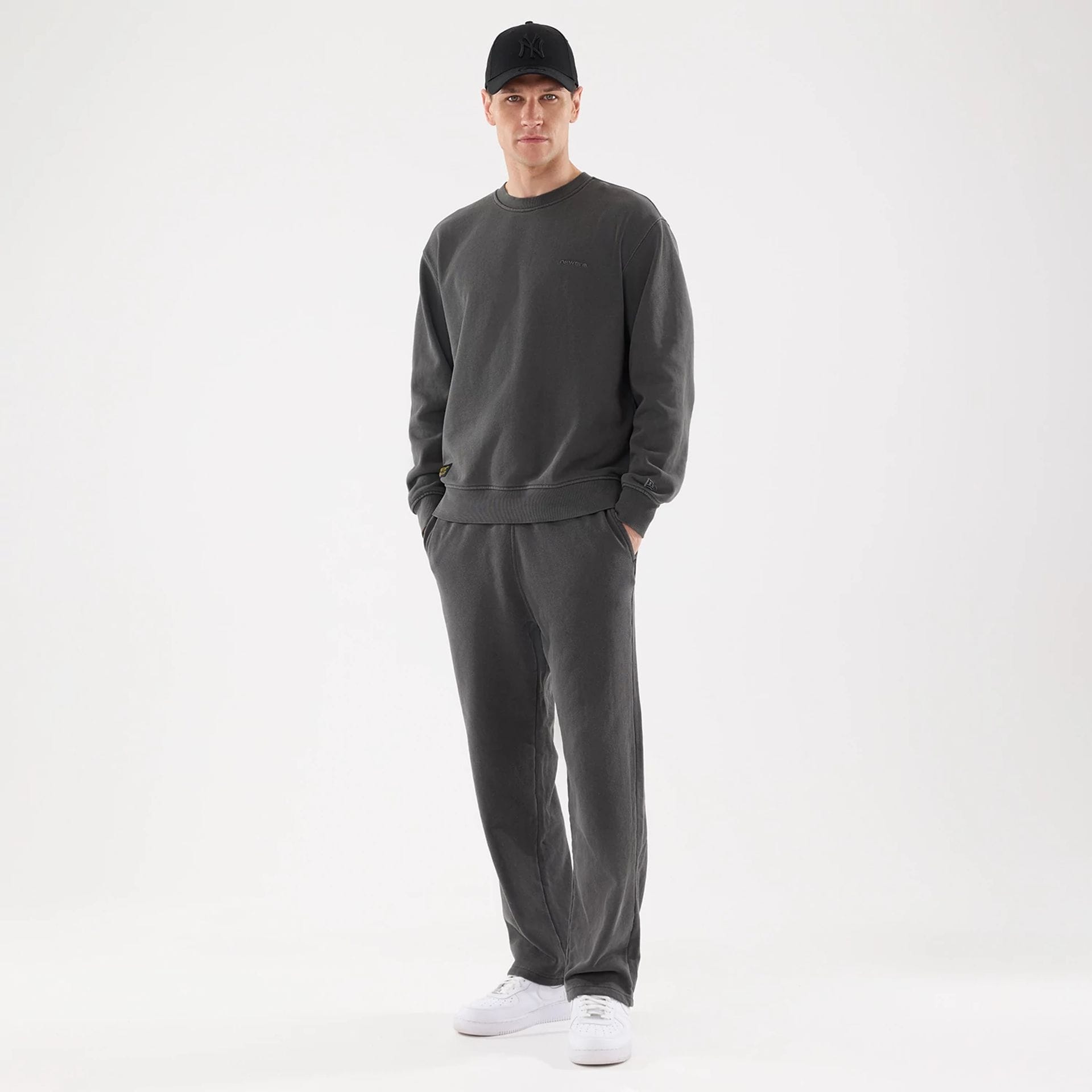 The model is wearing this New Era Originators Straight Leg Joggers in black. 8