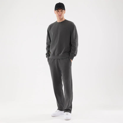 The model is wearing this New Era Originators Straight Leg Joggers in black. 8
