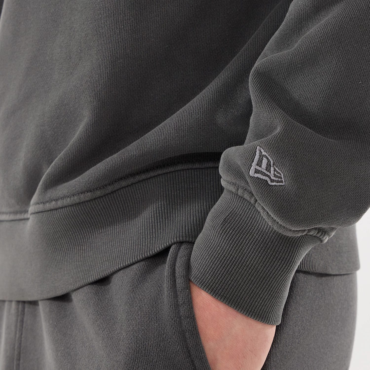 The model is wearing this New Era Originators Crew Neck Sweater in black. 5