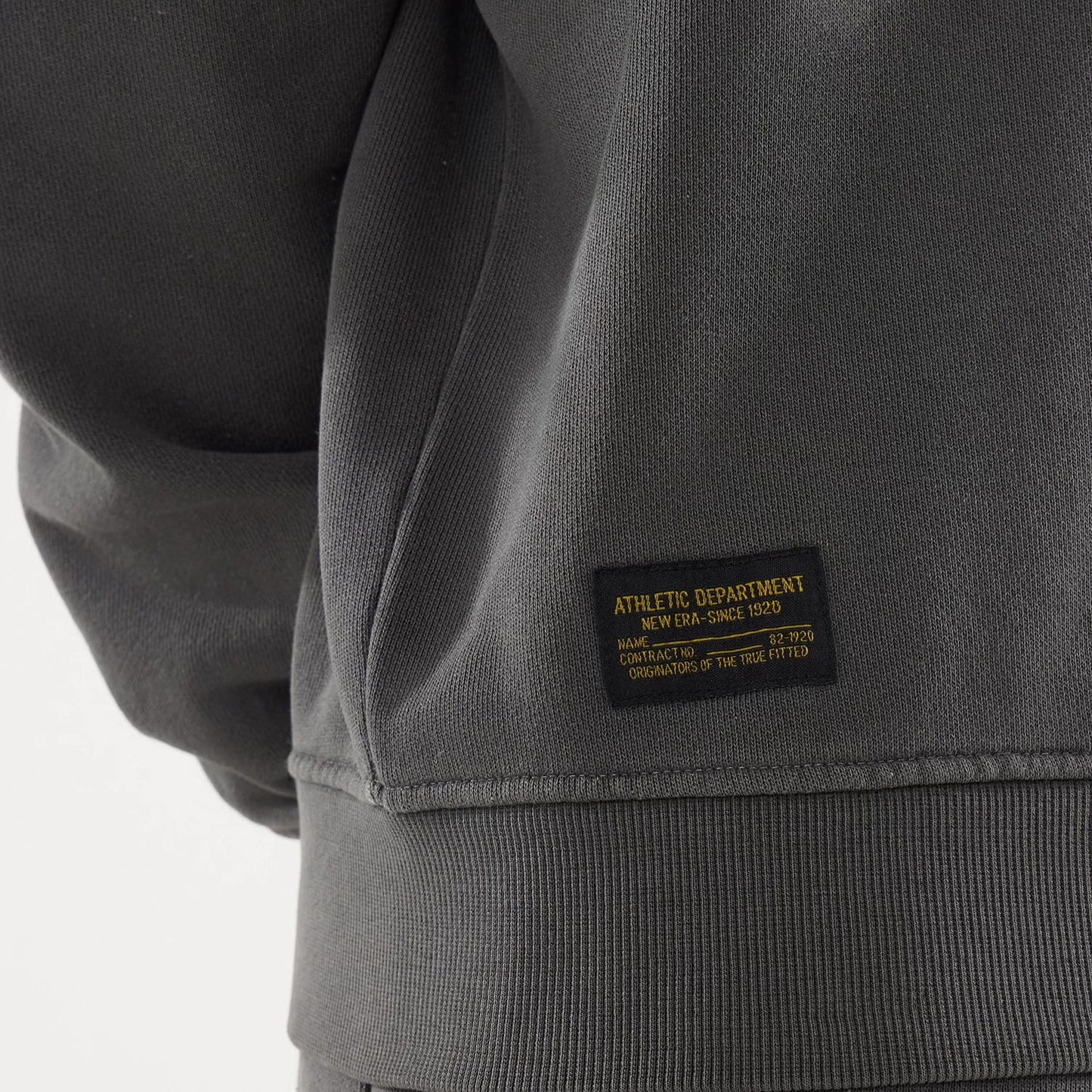 The model is wearing this New Era Originators Crew Neck Sweater in black. 4