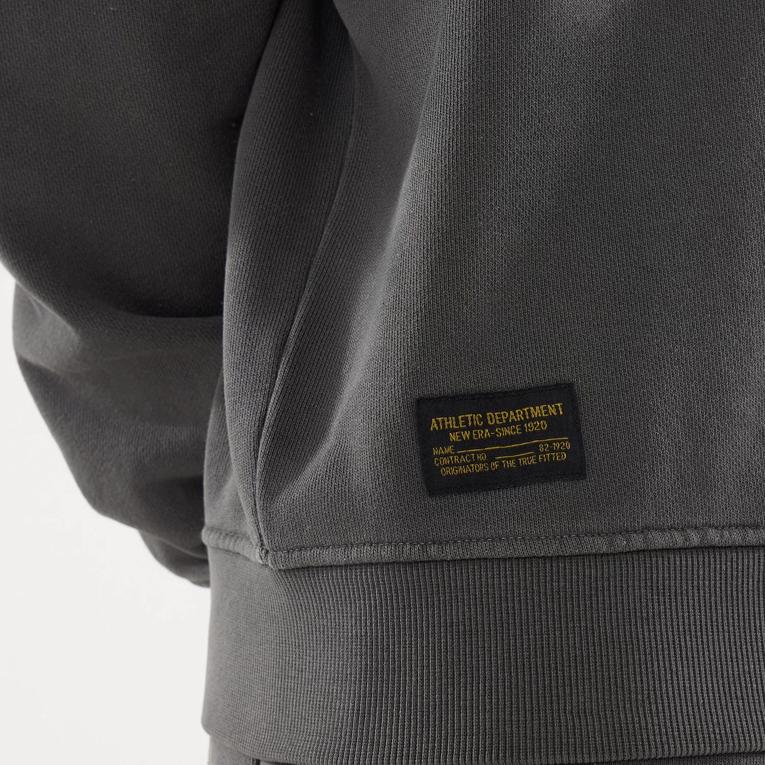 The model is wearing this New Era Originators Crew Neck Sweater in black. 4