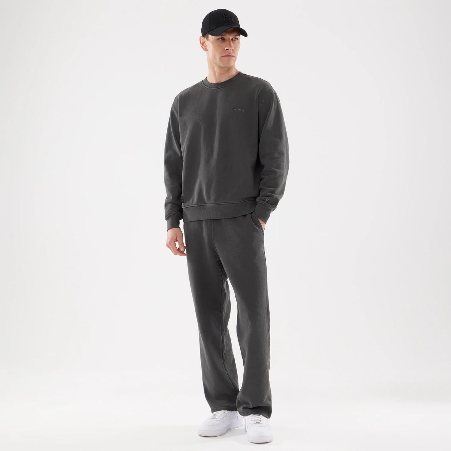 The model is wearing this New Era Originators Crew Neck Sweater in black. 8