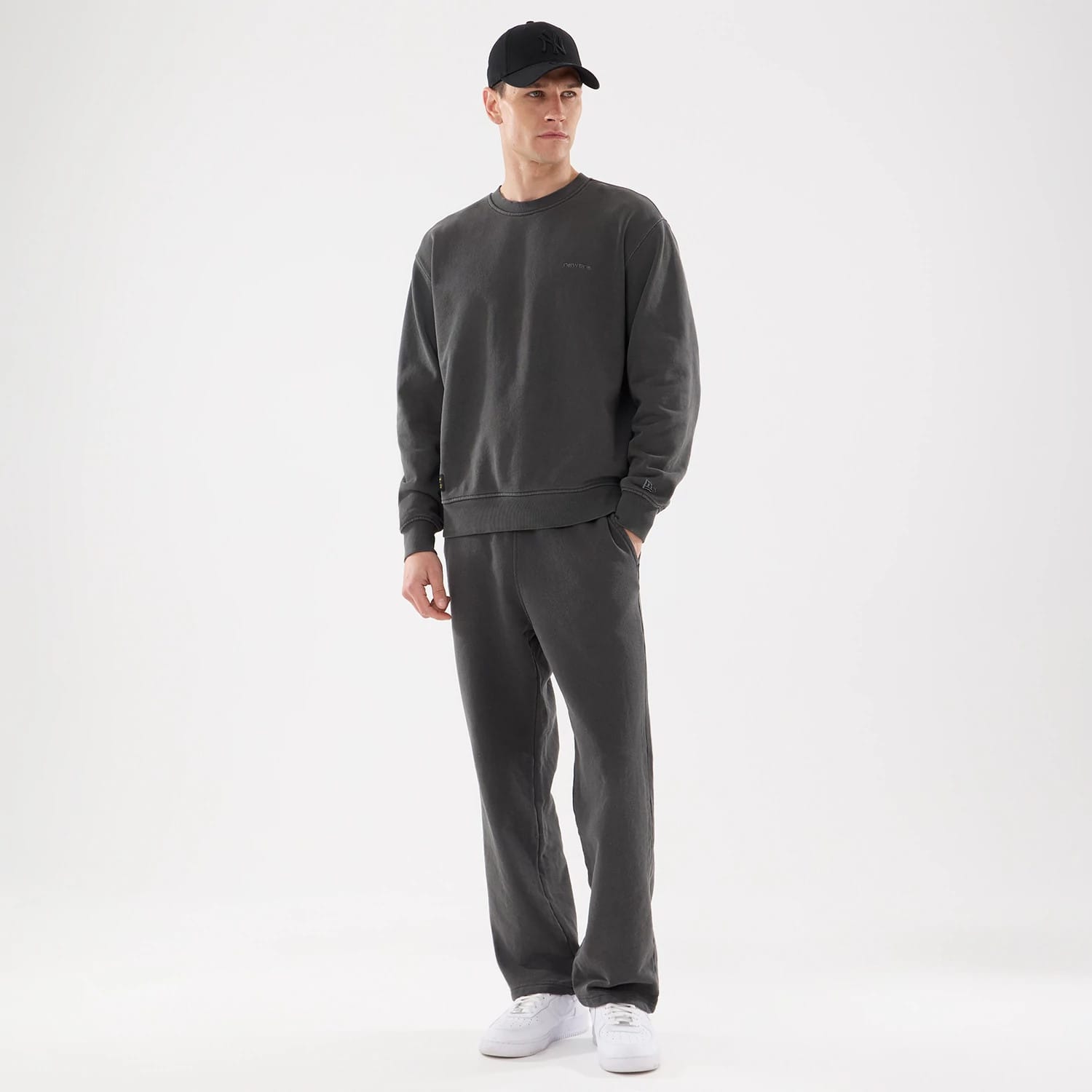 The model is wearing this New Era Originators Crew Neck Sweater in black. 8