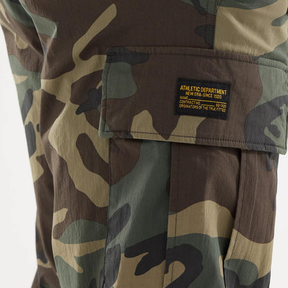 The model is wearing this New Era Originators Cargo Trousers in dark green. 5