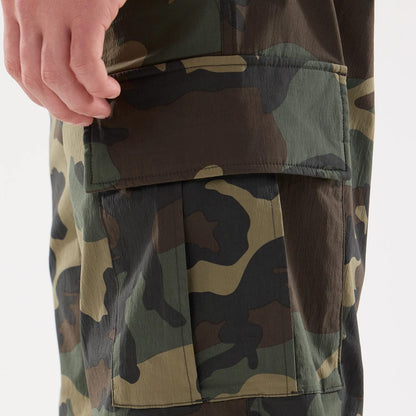 The model is wearing this New Era Originators Cargo Trousers in dark green. 6