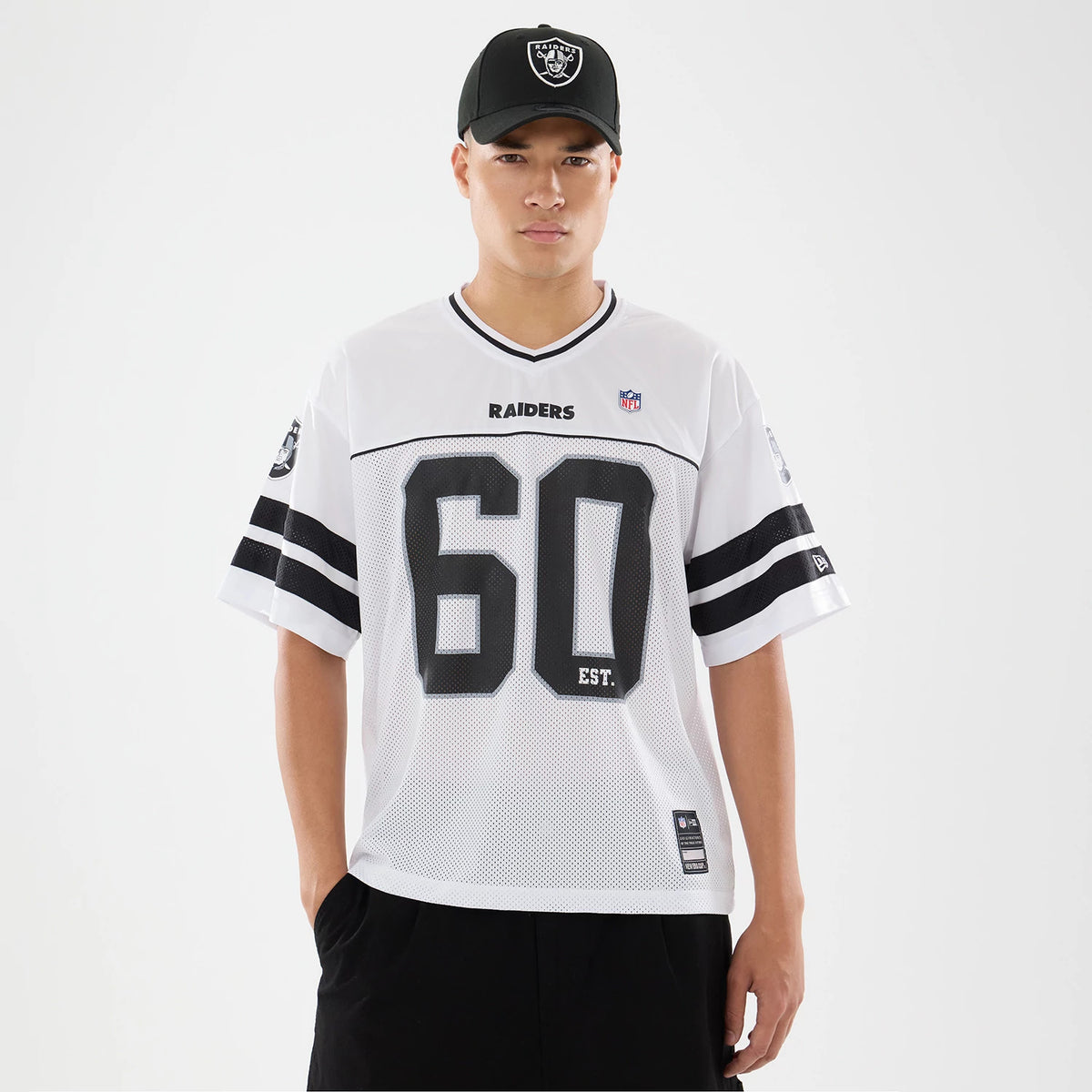 The model is wearing this NFL Las Vegas Raiders Mesh Jersey in white. 1