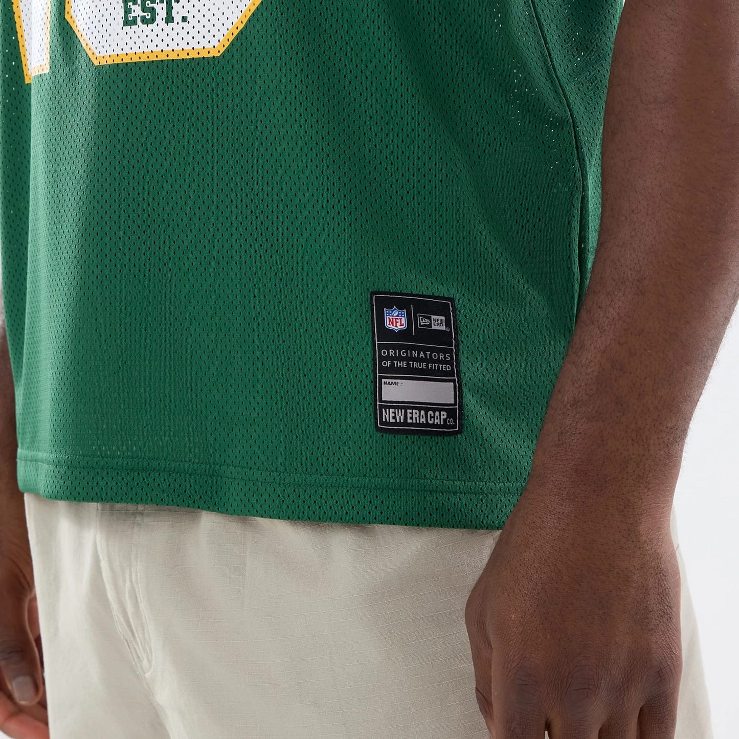 The model is wearing this NFL Green Bay Packers Mesh Jersey in green. 4