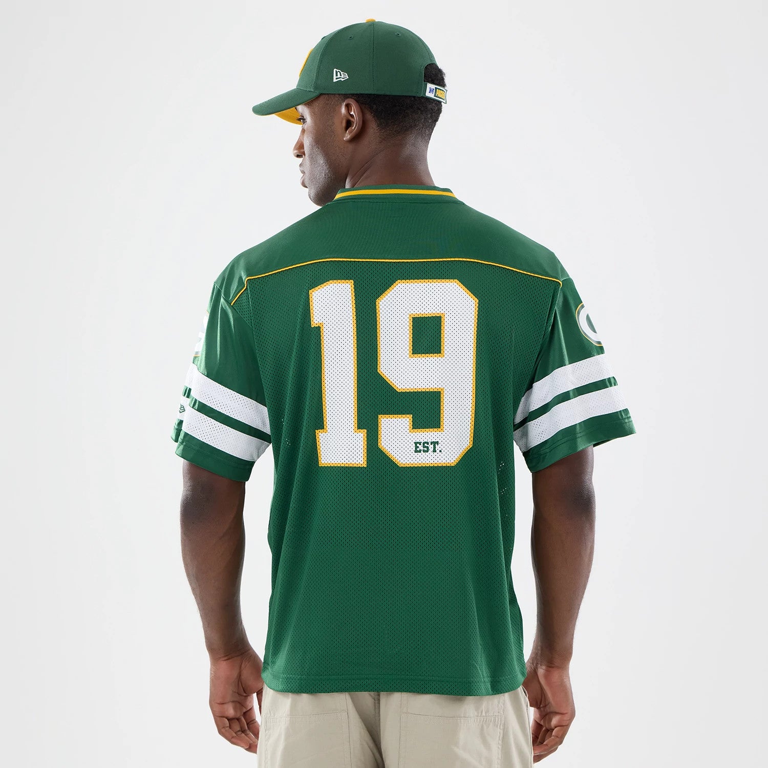 The model is wearing this NFL Green Bay Packers Mesh Jersey in green. 2