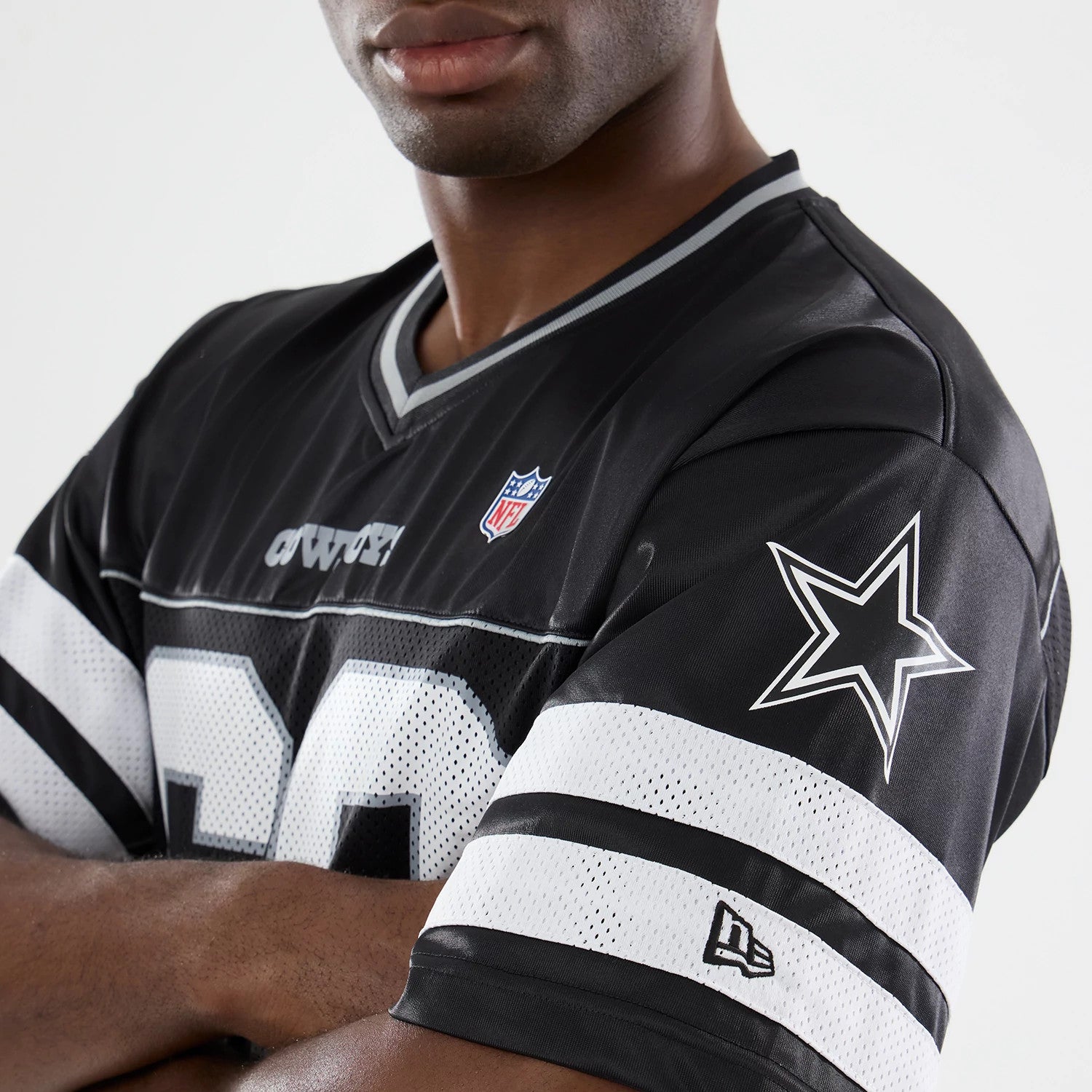 The model is wearing this NFL Dallas Cowboys Mesh Jersey in black. 3