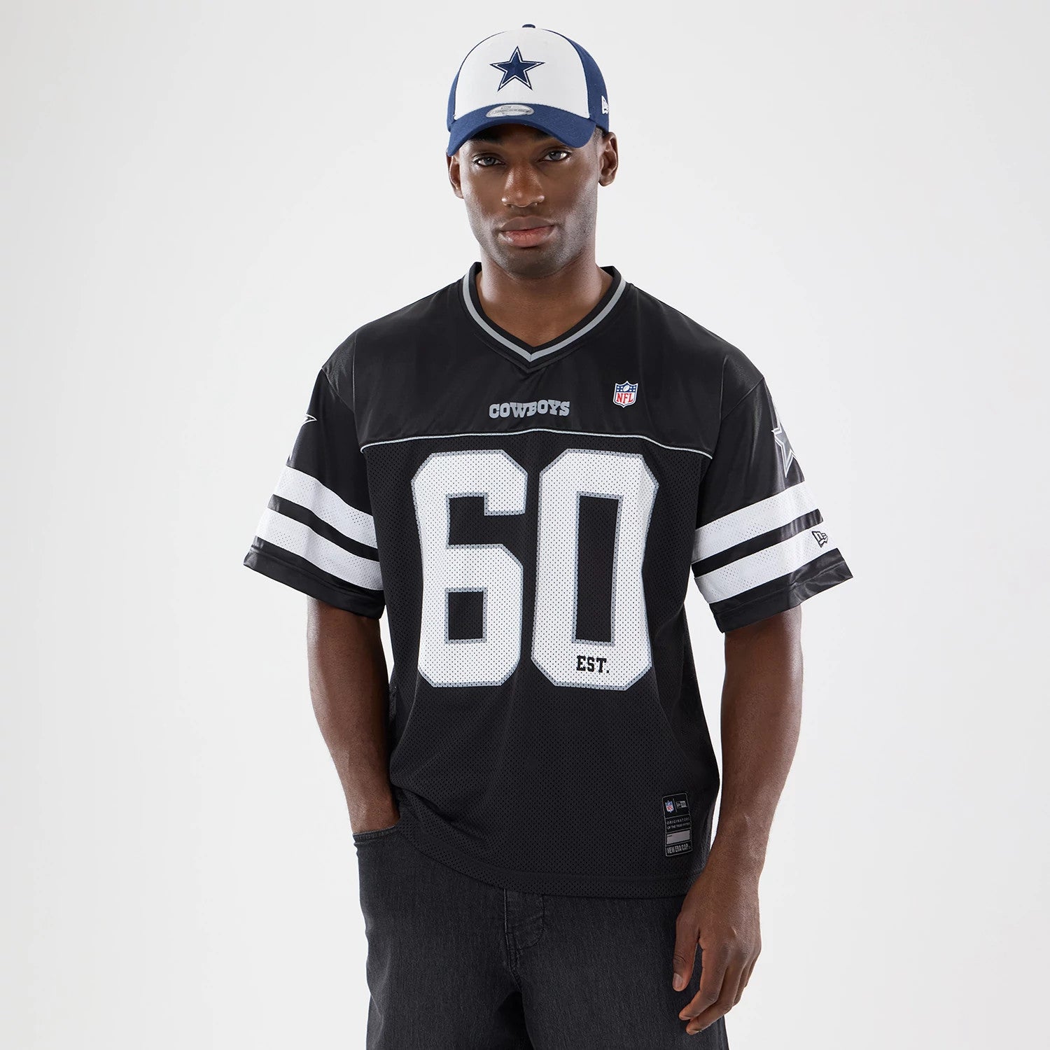 The model is wearing this NFL Dallas Cowboys Mesh Jersey in black. 1