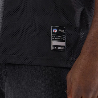 The model is wearing this NFL Dallas Cowboys Mesh Jersey in black. 5