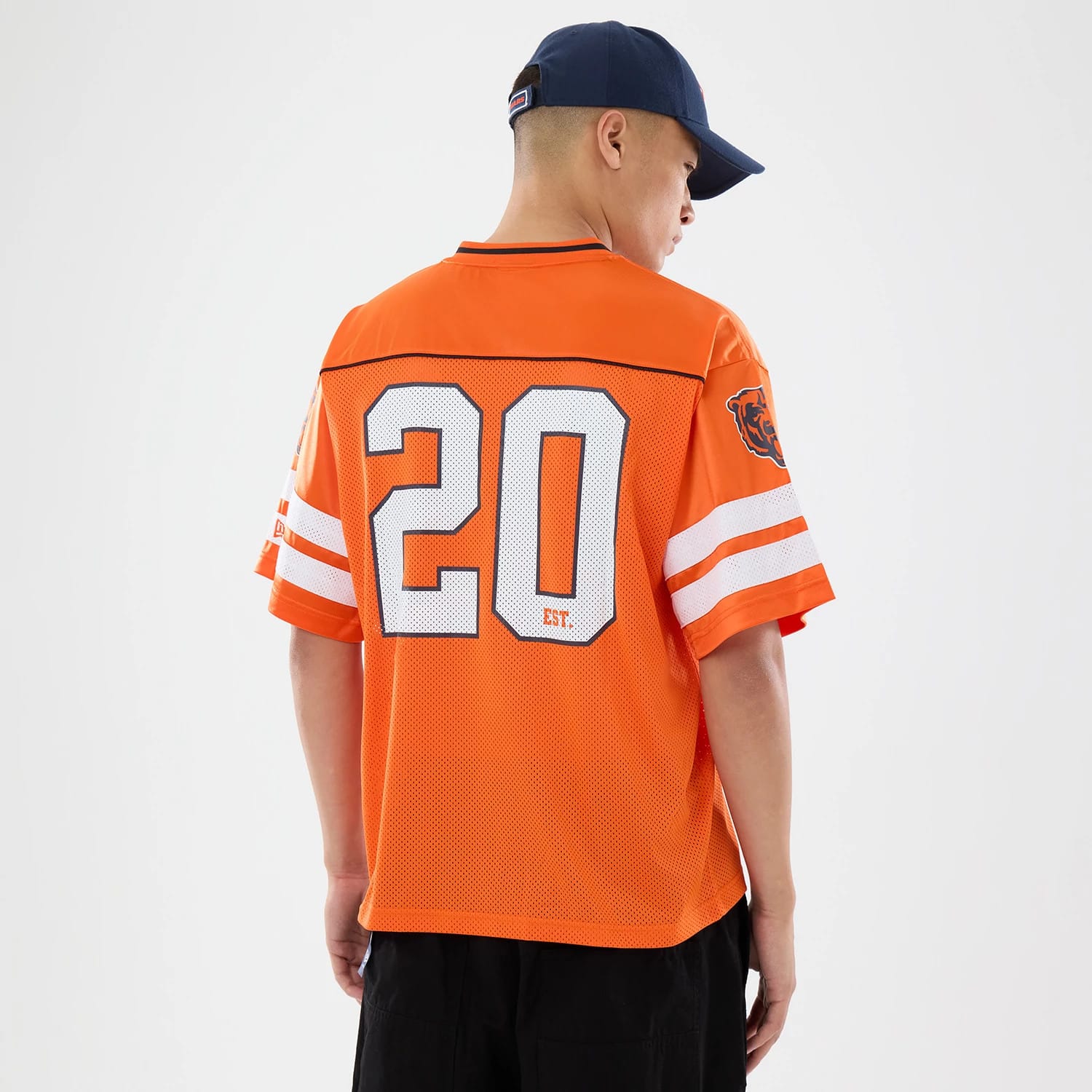 The model is wearing this NFL Chicago Bears Mesh Jersey in orange. 2