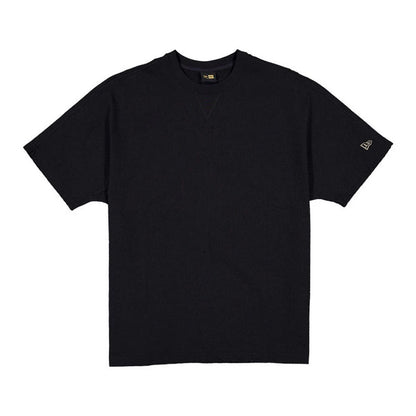 The model is wearing this New Era Black Label Seersucker T-Shirt in black. 1