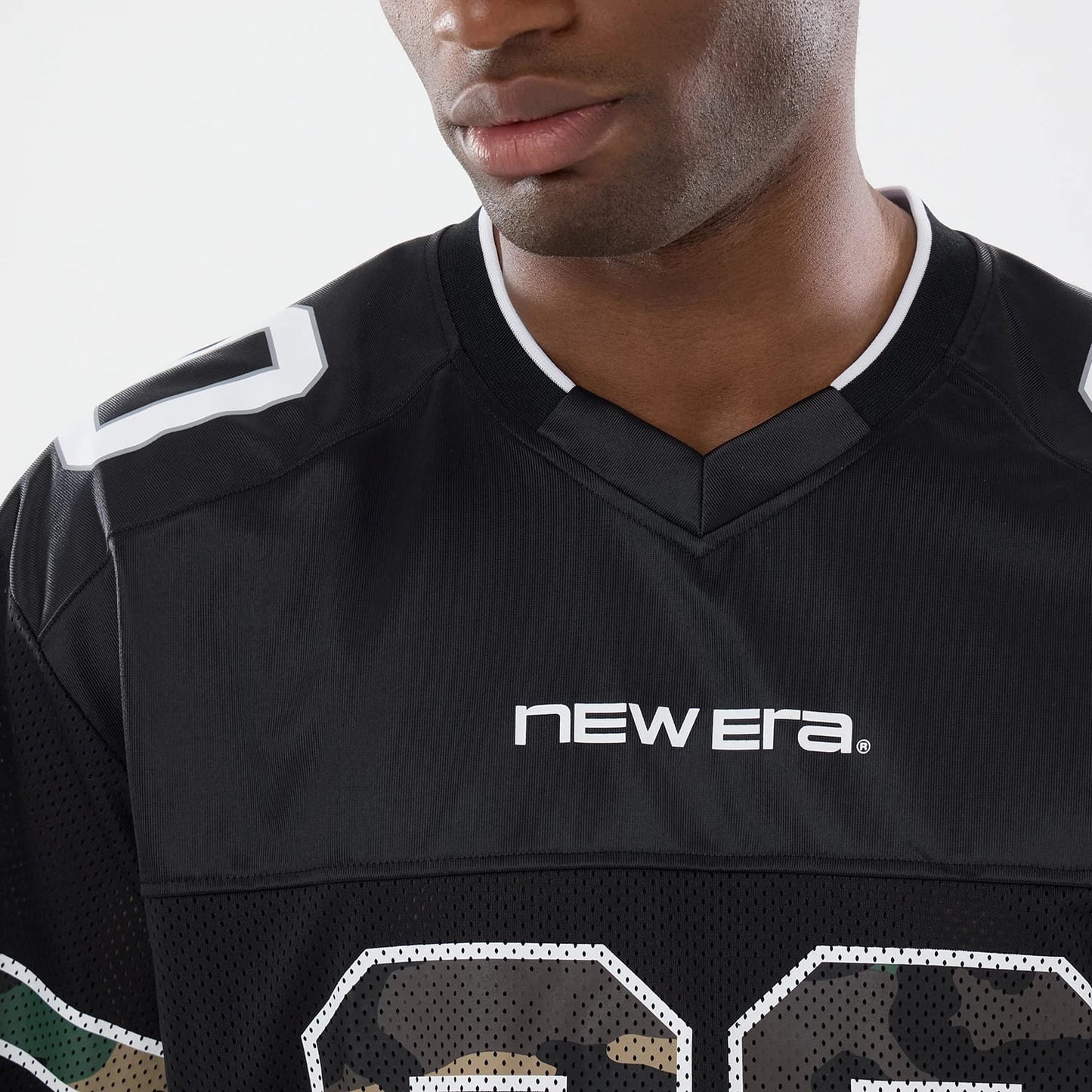The model is wearing this New Era 1920 Mesh Jersey in black. 4